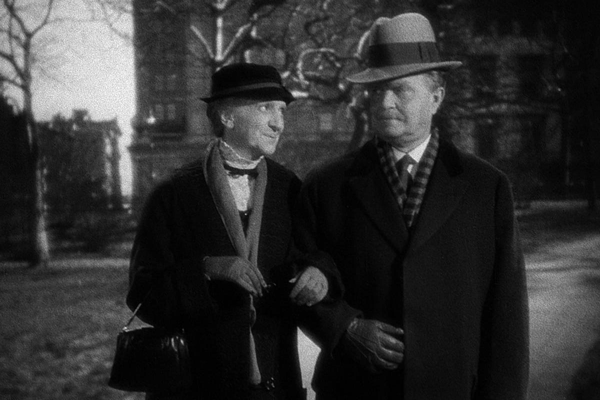 Victor Moore and Beulah Bondi strolling arm in arm, in a scene from MAKE WAY FOR TOMORROW.